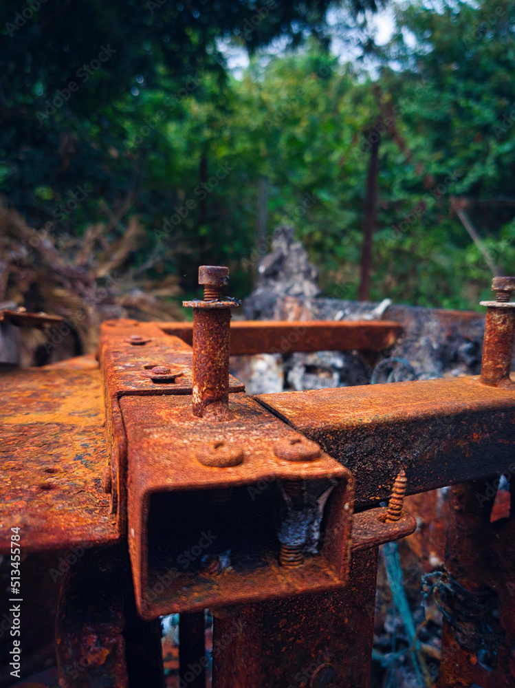 Close up of a rusted and burnt screw on a massage chair Close up of a rusted and burnt screw on a massage chair