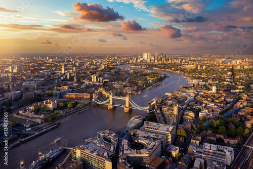 Beautiful, panoramic sunset view of the skyline of London with Tower Bridge along the river Thames until Canary Wharf, England