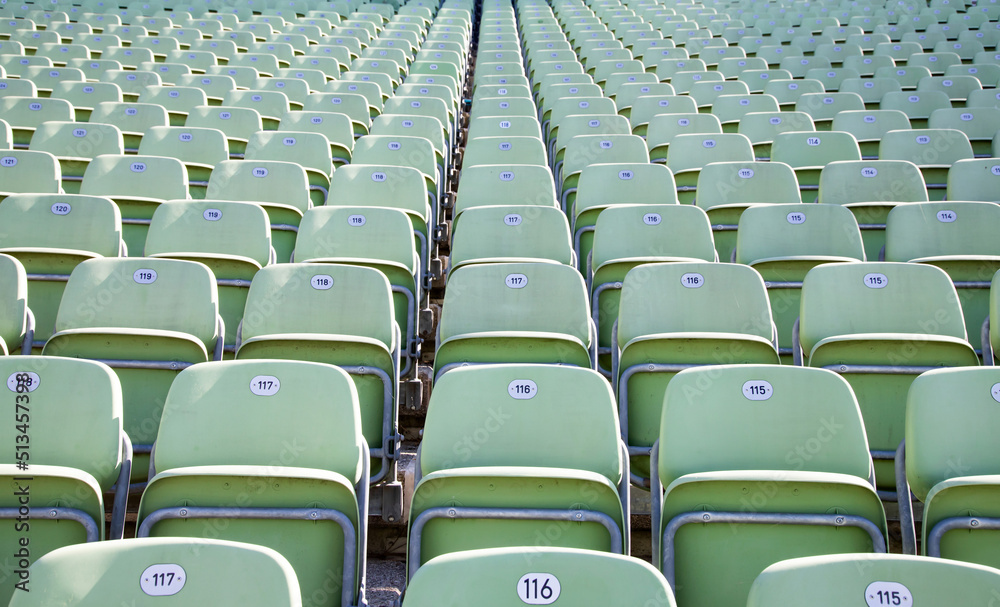 Obraz premium Empty Plastic Chairs at the Stadium