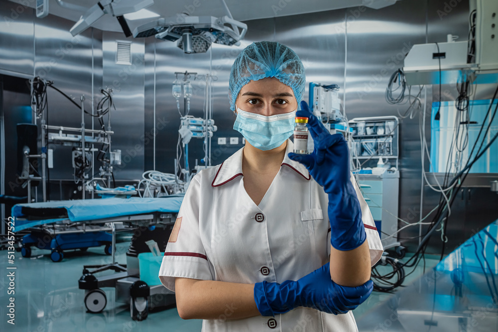 woman doctor in medical uniform with a protective mask and gloves and look for vaccine