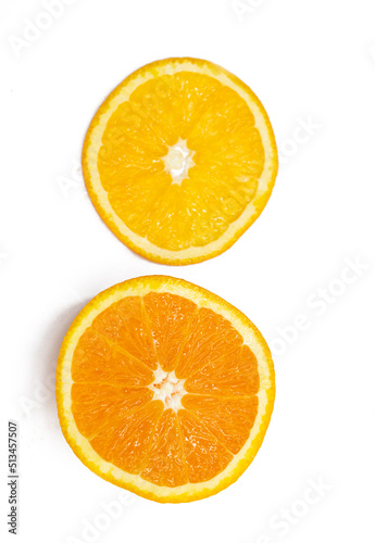 fresh orange fruit slices over on white background.top view