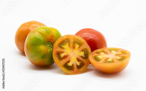 group of different types tomatoes over on white background