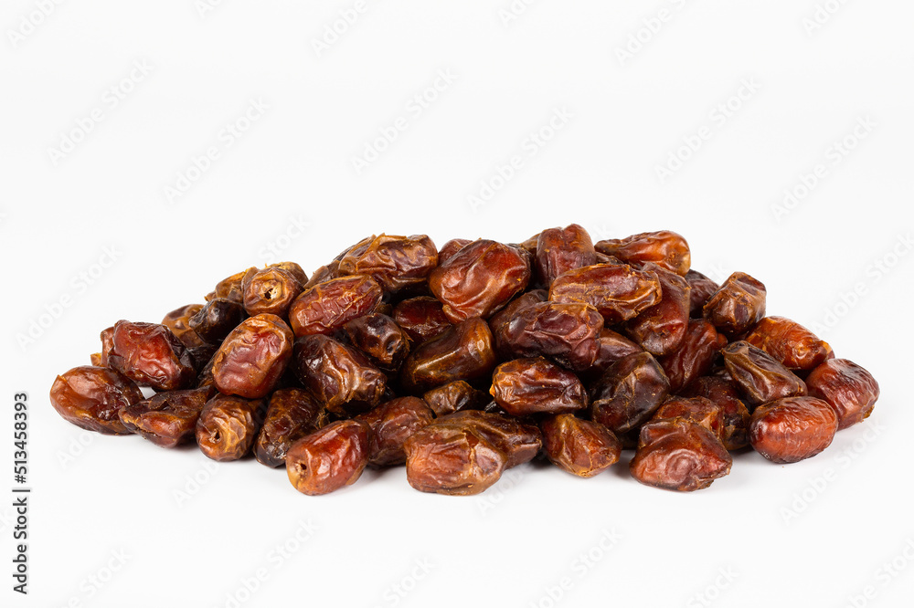 Heap of pitted dates isolated on white background Heap of pitted dates isolated on white background