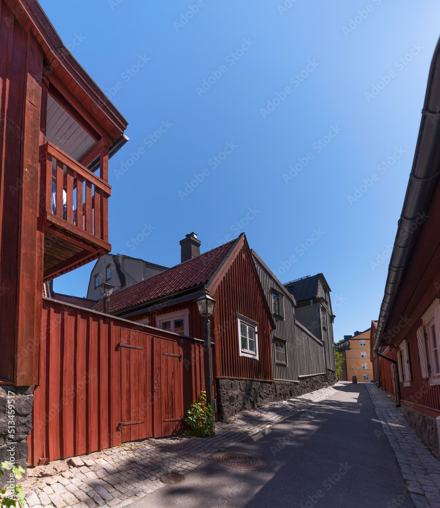 Old wood houses in the block Djurgårdsstaden at the street Breda Gatan in the island Djurgården a sunny summer day in Stockholm