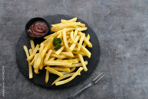 French Fries, tasty and savory fast food served with chili sauce. Space for text.
