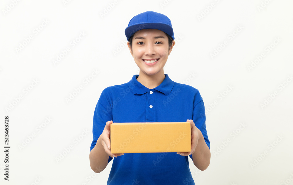 Happy delivery asian woman in blue uniform standing holding parcel cardboard box on isolated white background. Smiling female delivery sending box package service worker. Happy delivery asian woman in blue uniform standing holding parcel cardboard box on isolated white background. Smiling female delivery sending box package service worker.