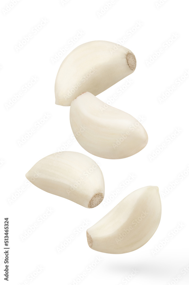 Flying delicious garlic cloves, isolated on white background Flying delicious garlic cloves, isolated on white background
