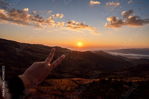 Summer mountains with sunset view of nature cliff mountain. Woman travel tourist alone morning freedom and happiness