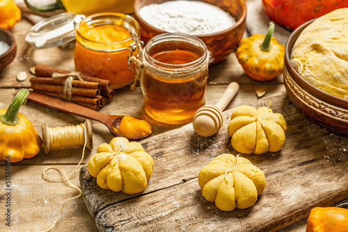 Pumpkin buns or biscuits, traditional fall baked goods. Seasonal ingredients for cooking food