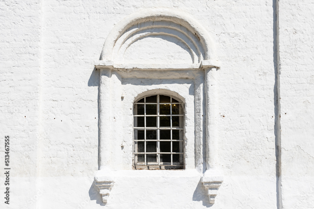 Fototapeta premium grille window in wall of ancient russian church