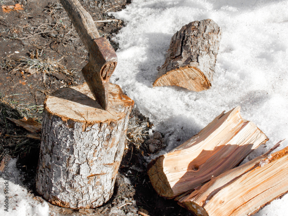 Interior of the wood chopping. Axe and firewood Interior of the wood chopping. Axe and firewood