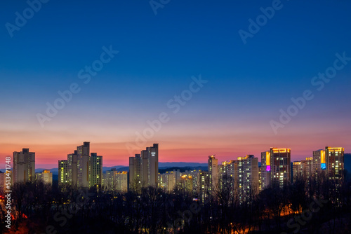 Scenic view of city scape against sky during sunset