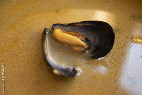 drunken mussel in white wine broth photo