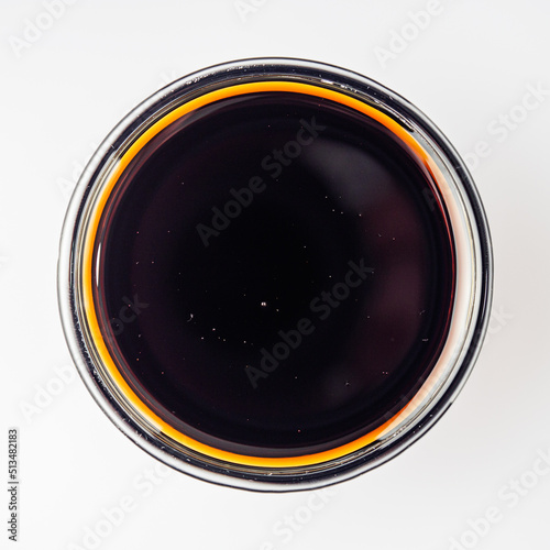 fresh pomegranate sauce narsharab on a white acrylic background photo