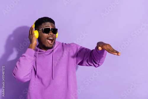 Photography Portrait of attractive cheerful funny guy listening bass soul jazz having fun is