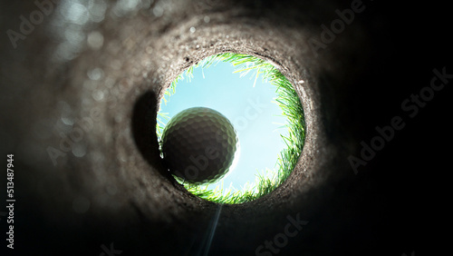 Vászonkép Detail of golf ball, view from inside the hole.