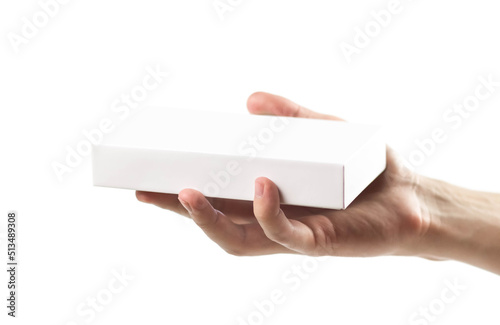 Wallpaper Mural The hand holds a white box with a new smartphone. Close up. Isolated on a white background Torontodigital.ca