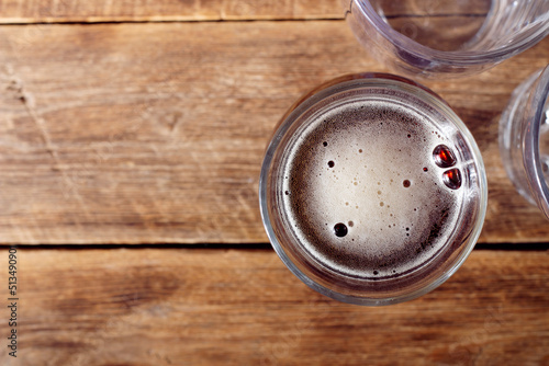 Glass of beer  in a pub top view background