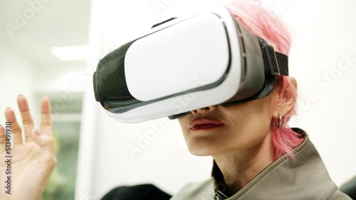 Female used VR Headset at Living Room