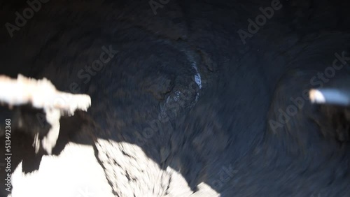Preparation of cement mortar using a concrete mixer. Construction works. Mixing of mortar for plastering walls