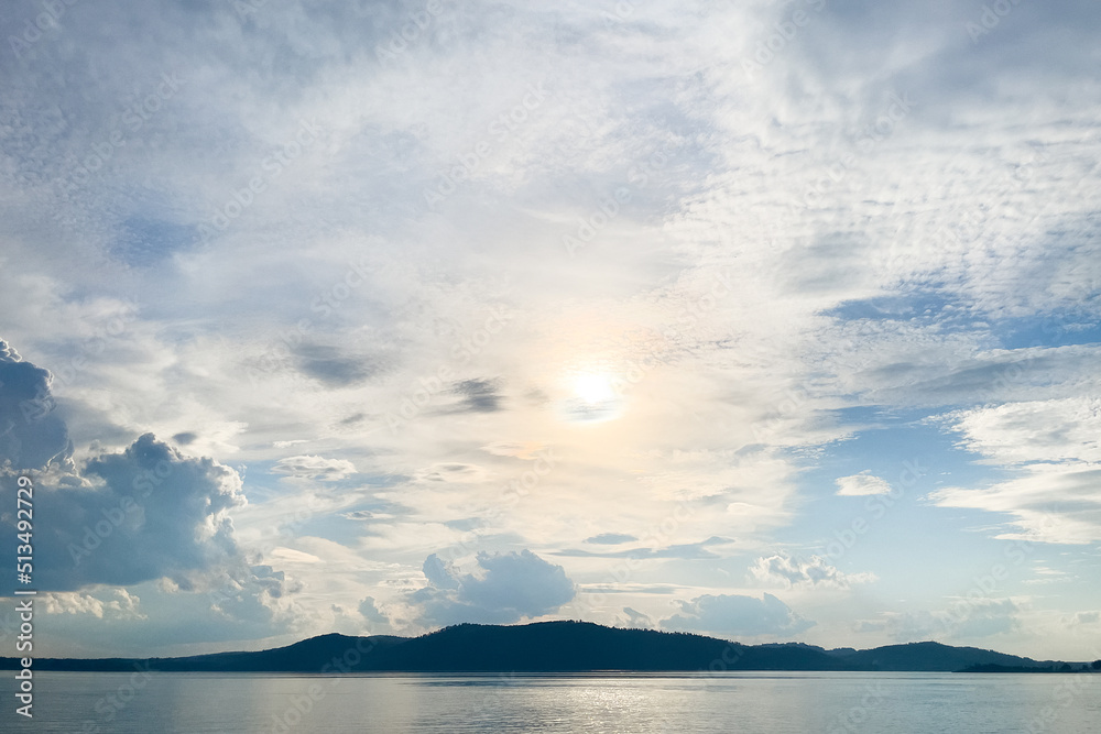 the shoreline of the river in the rays of the sun