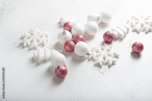 White and pink decorations for holiday on light surface