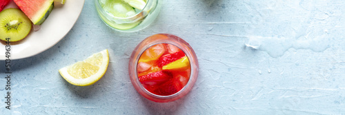 Summer cocktails with fresh fruit. Healthy cold mocktails at a party. Vibrant drinks panorama, shot from the top, a flat lay