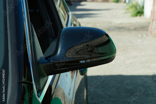 AUDI Q3 in black. Subcompact luxury crossover Audi Q3. Side mirror view