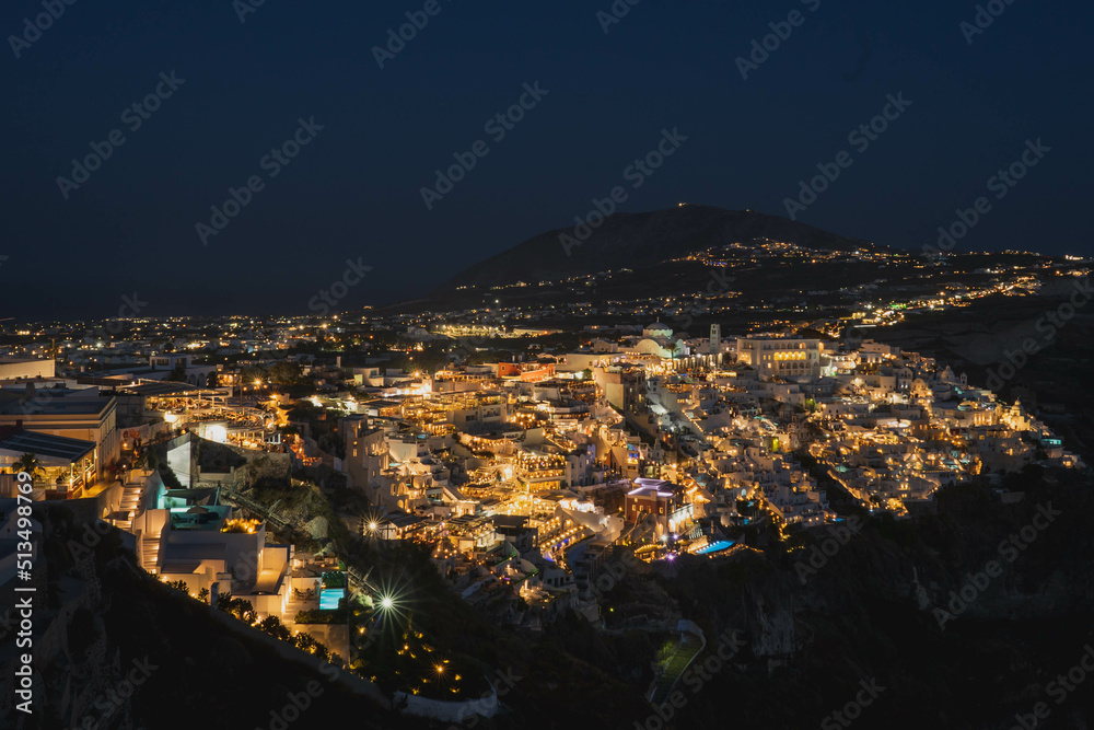 Amazing night view of Fira (Thera) city in Santorini and amazing calderas.