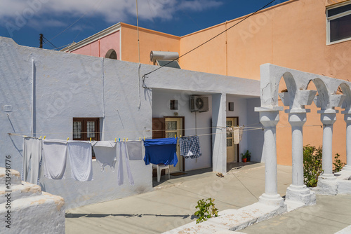 Fototapeta Naklejka Na Ścianę i Meble -  Streets and buildings in the street of Fira (Thera) city on the island of Santorini, Greece.