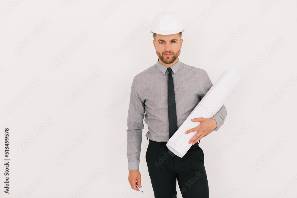 Happy male chief architect holding drawing with copy space on a white background Happy male chief architect holding drawing with copy space on a white background