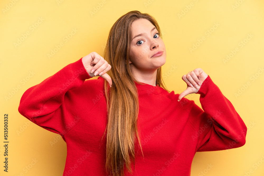 Young caucasian woman isolated on yellow background feels proud and self confident, example to follow. Young caucasian woman isolated on yellow background feels proud and self confident, example to follow.