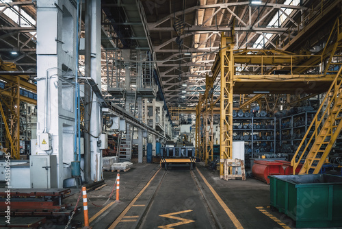 Interior of big industrial factory inside. Metalworking plant, heavy industry.