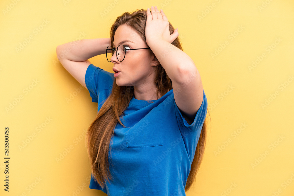 Young caucasian woman isolated on yellow background screaming, very excited, passionate, satisfied with something. Young caucasian woman isolated on yellow background screaming, very excited, passionate, satisfied with something.