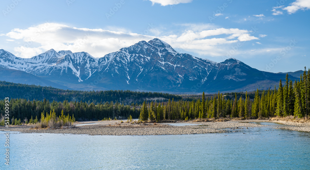 Jasper National Park Canadian Rockies landscape. Athabasca River forest and Pyramid Mountain nature scenery background. Old Fort Point trail sunset time. AB, Canada.