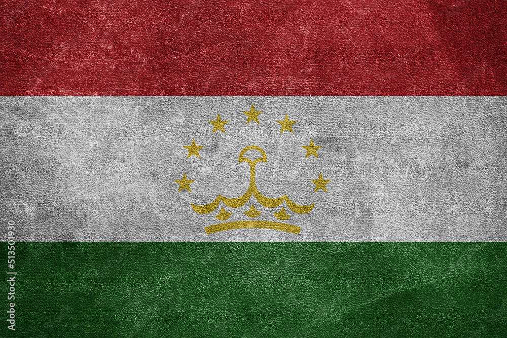 Old leather shabby background in colors of national flag. Tajikistan