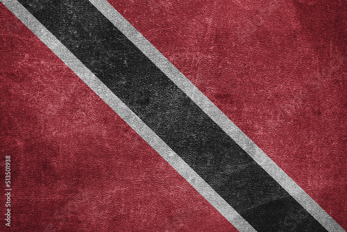 Old leather shabby background in colors of national flag. Trinidad and Tobago