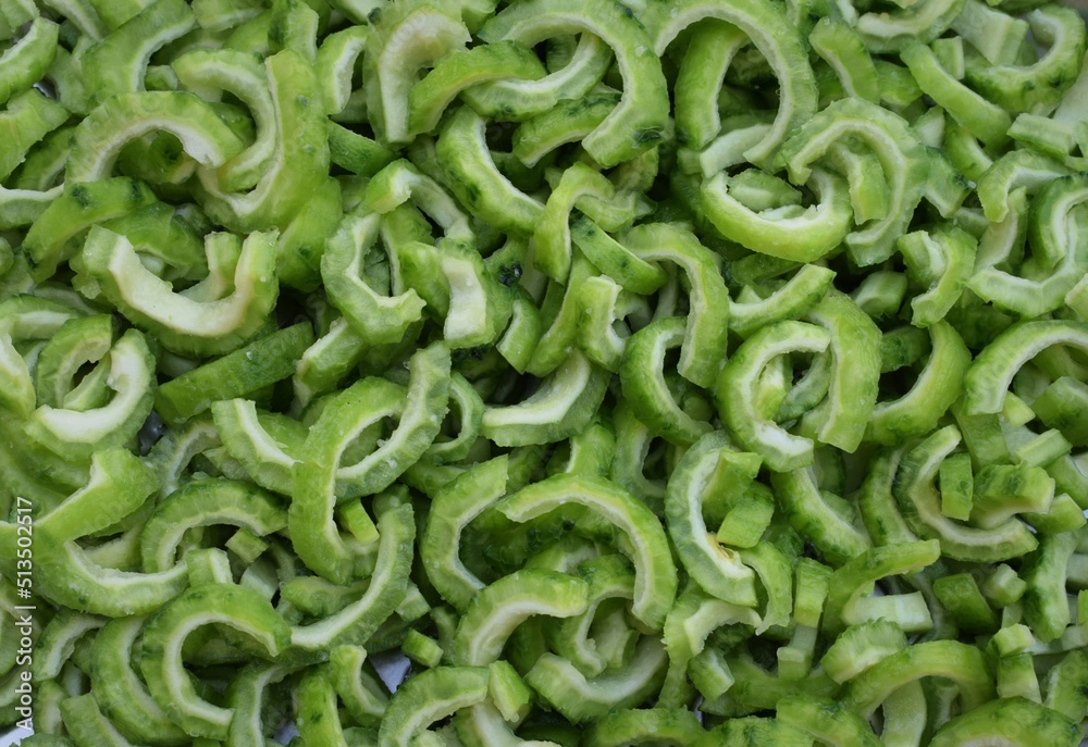 Bitter melon cut into small pieces. This vegetable is also called as gourd or momordica charantia. Bitter melon cut into small pieces. This vegetable is also called as gourd or momordica charantia.