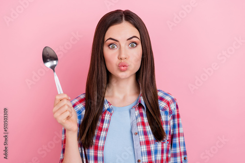 Portrait of positive funny lady pout lips can't wait to ear yummy dessert addicted to sweets isolated on pink color background