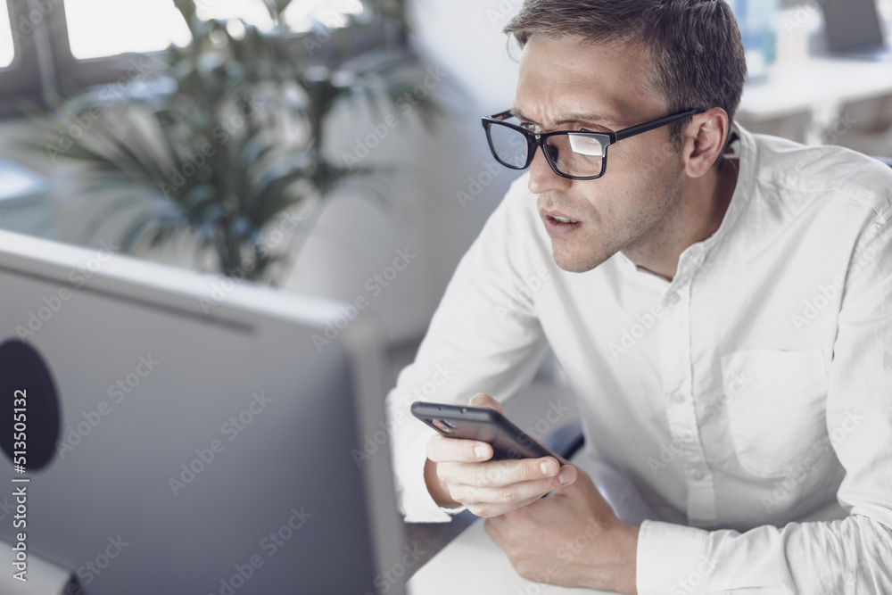Businessman having problems with his devices Businessman having problems with his devices