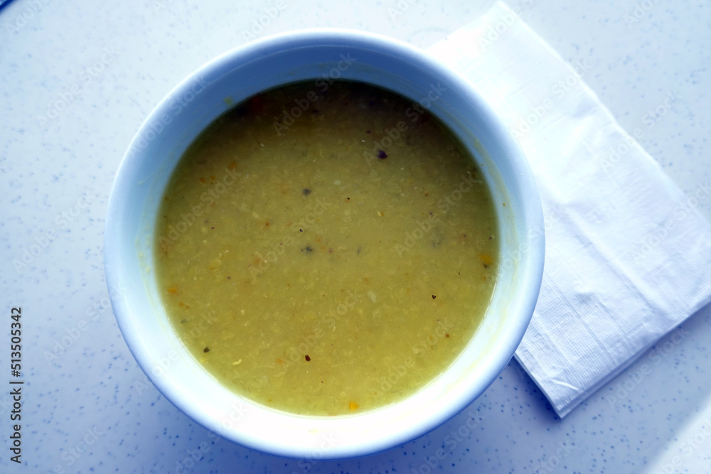 Yellow rentil soup white plate background. Yellow rentil soup white plate background.