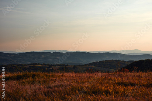 View of countryside hilly landscape in autumn colors. © astrosystem