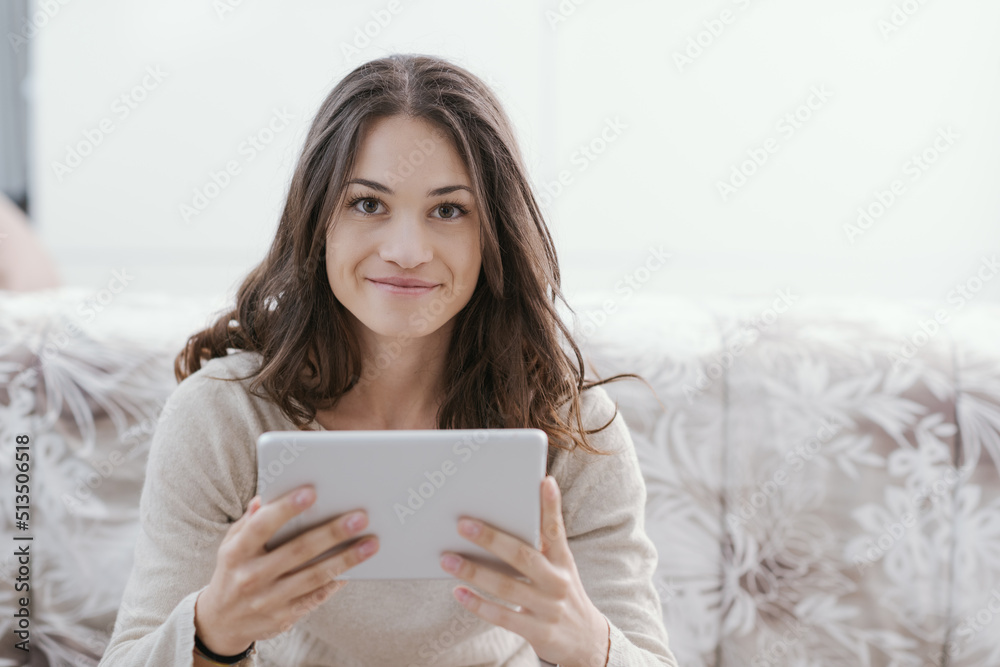 Happy woman connecting with her tablet Happy woman connecting with her tablet