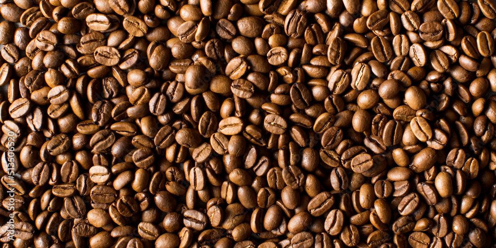 Background of roasted coffee beans full frame. A coffee-themed banner. Background of roasted coffee beans full frame. A coffee-themed banner.