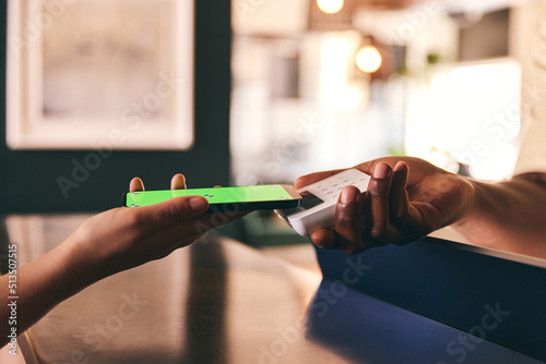 Customer Paying Using Smartphone Mobile Payment NFC Contactless Technology, Closeup Hands Only Green Screen photo