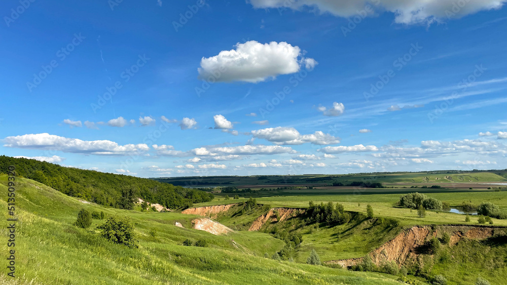 Naklejka premium green ravines and plains with small trees