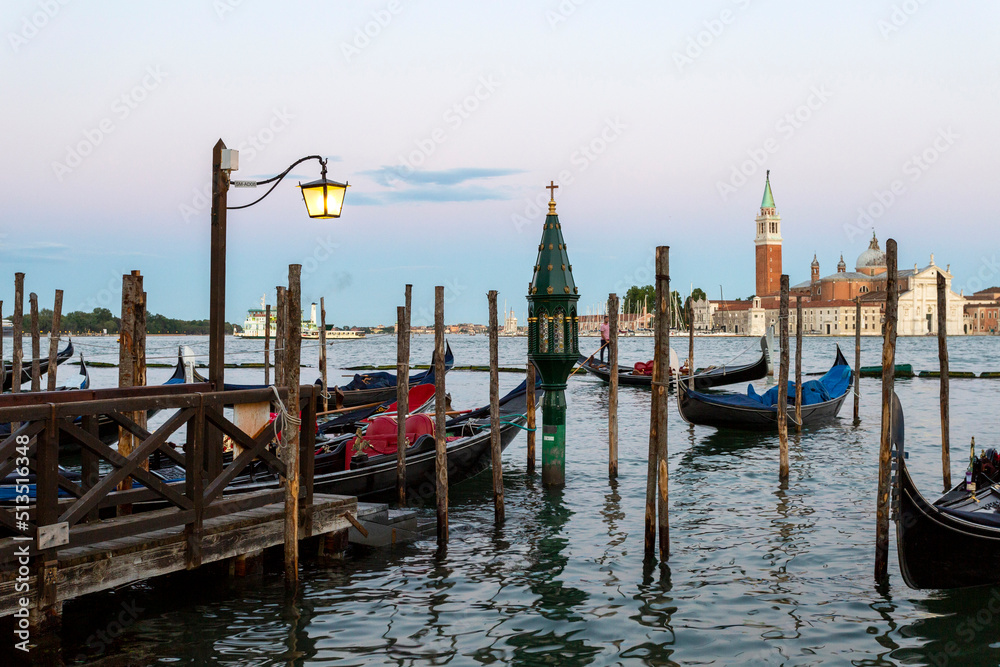 Gondola boats on the see with the Church of San Giorgio Maggiore