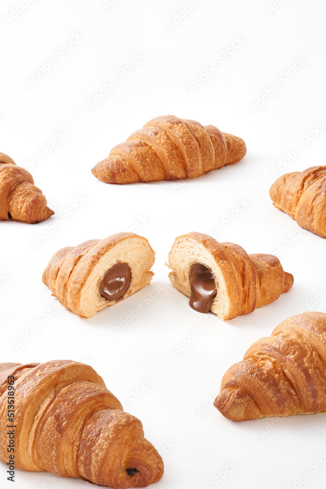 French butter croissants with caramel filling isolated on white background. 