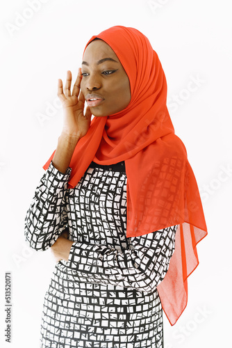 Nigerian woman in traditional clothes posing in studio