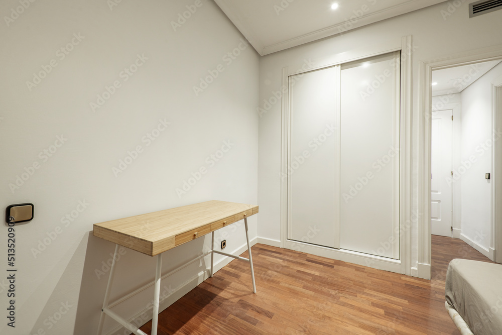 Room of a vacation rental house with reddish oak parquet flooring, a